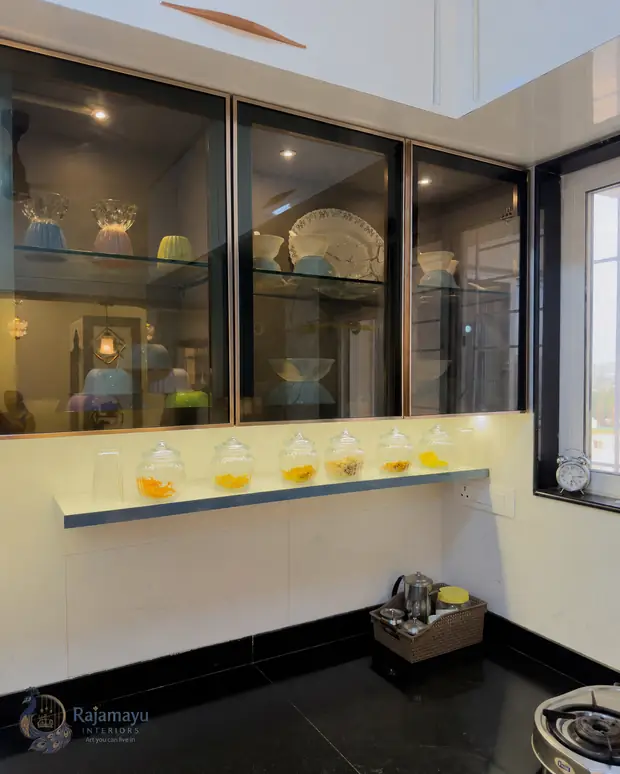 Glass wall units with service window by Rajamayu Interiors
