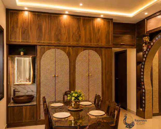 Dining area with jaali screens by Rajamayu Interiors