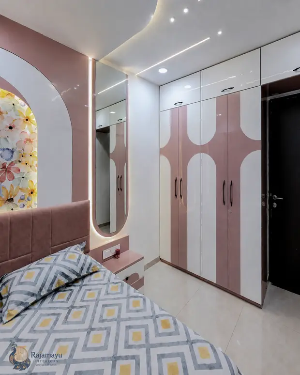 Arched wardrobe in blush and ivory by Rajamayu Interiors