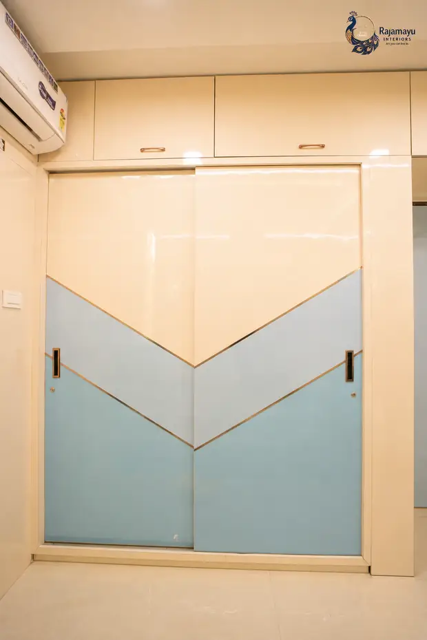 Chevron wardrobe in ivory and blue by Rajamayu Interiors
