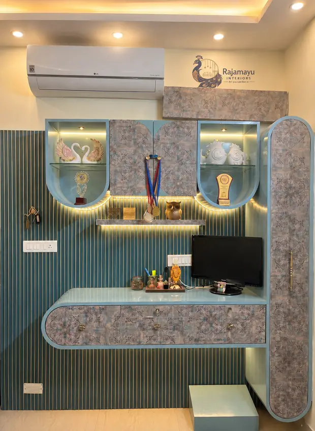 Study and display unit in blue by Rajamayu Interiors