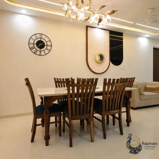 Dining with chandelier and feature ceiling by Rajamayu Interiors