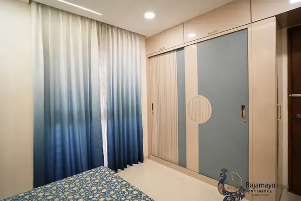 Wardrobe run with fluted panels by Rajamayu Interiors