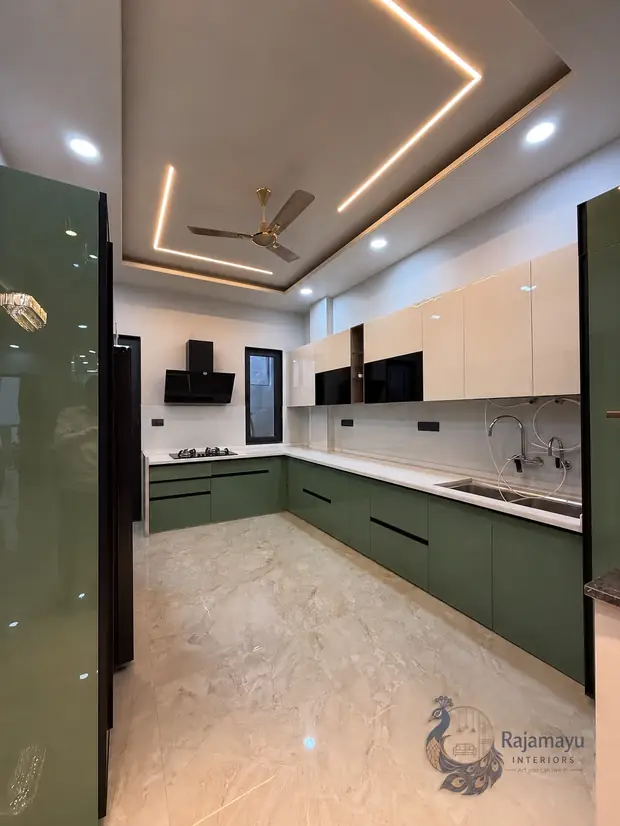 Parallel kitchen in green and ivory by Rajamayu Interiors